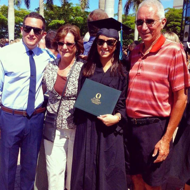 Miss Jenna's Graduation photo with her early childhood education bachelor's degree.